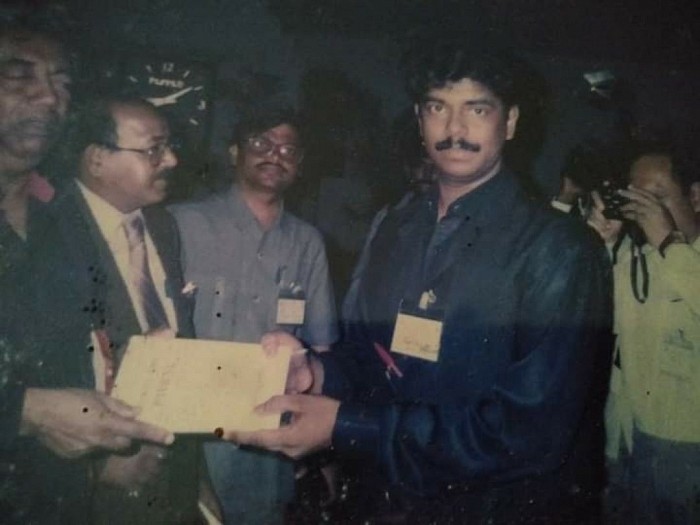 Pandit SIR.Prof.Dr.ANTON JAYASURIYA appreciates Prof.C.UNNIKRISHNAN awarding two books he wrote and a Golden Ring